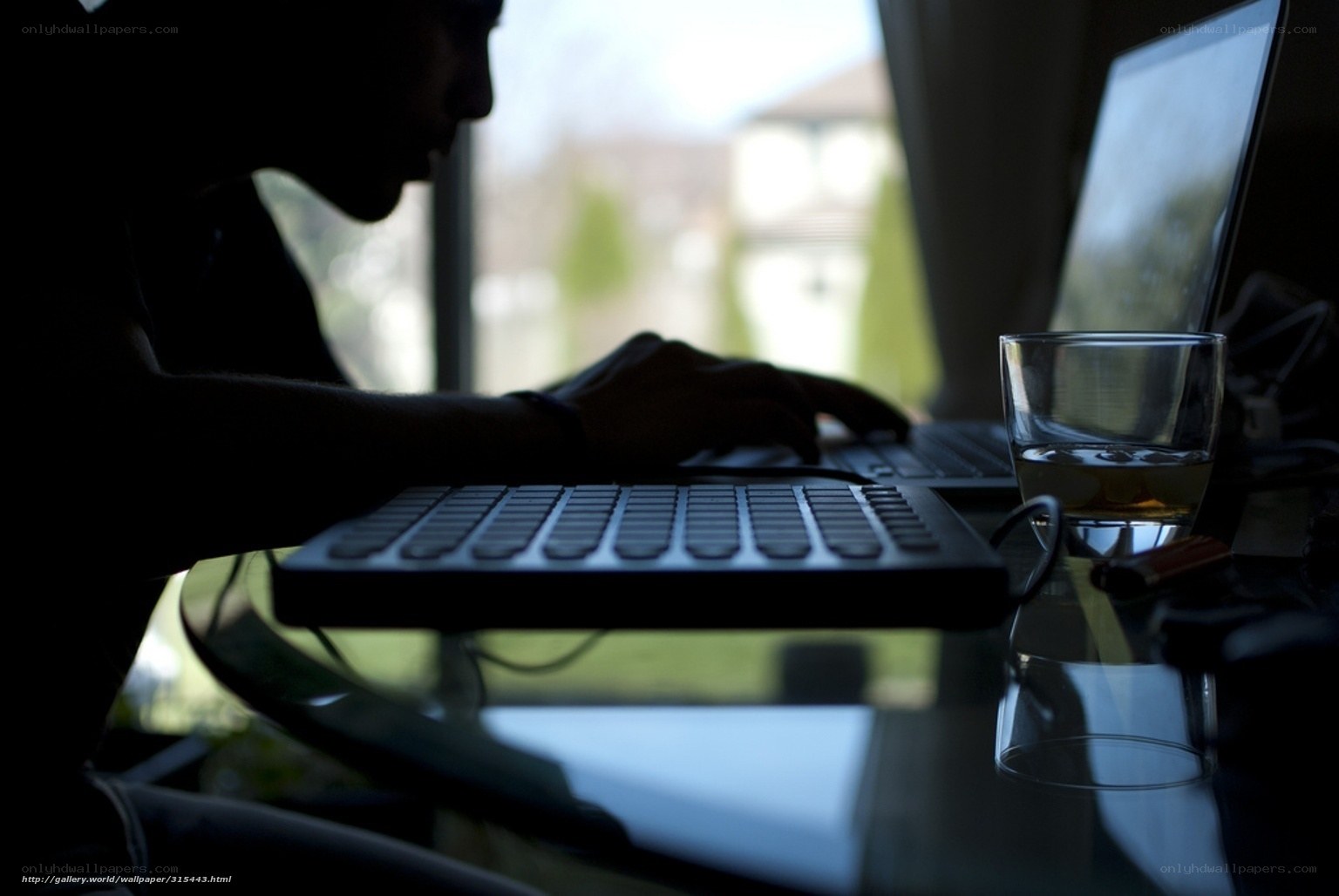 Person using laptop at desk