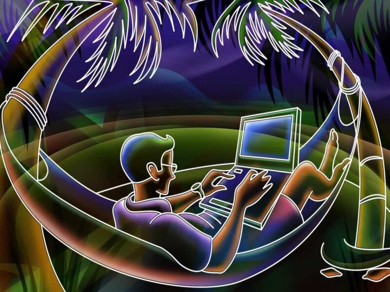 person using laptop in hammock
