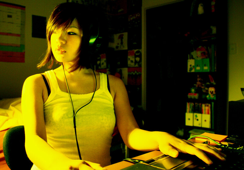 person using laptop with headphones