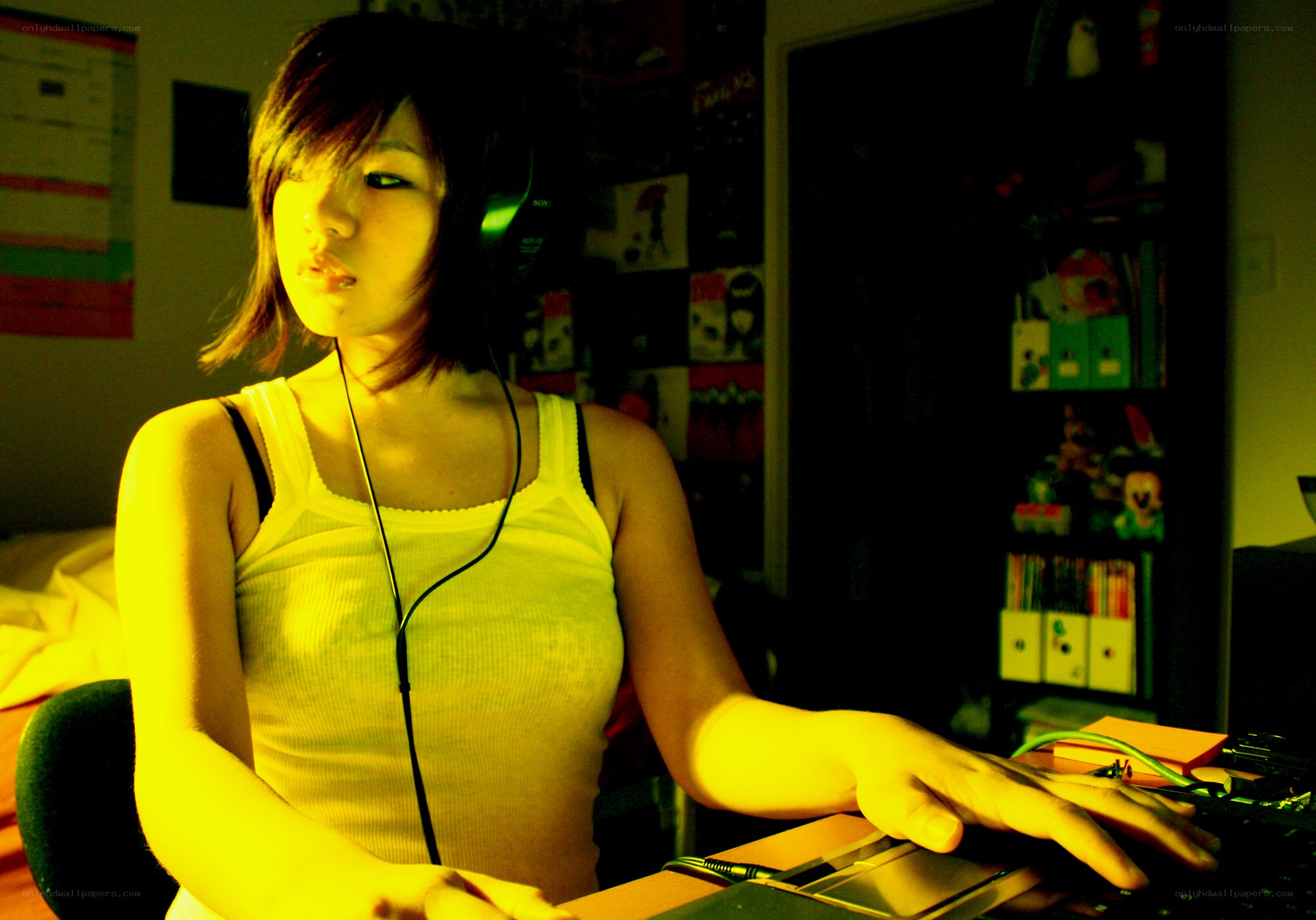 person using laptop with headphones