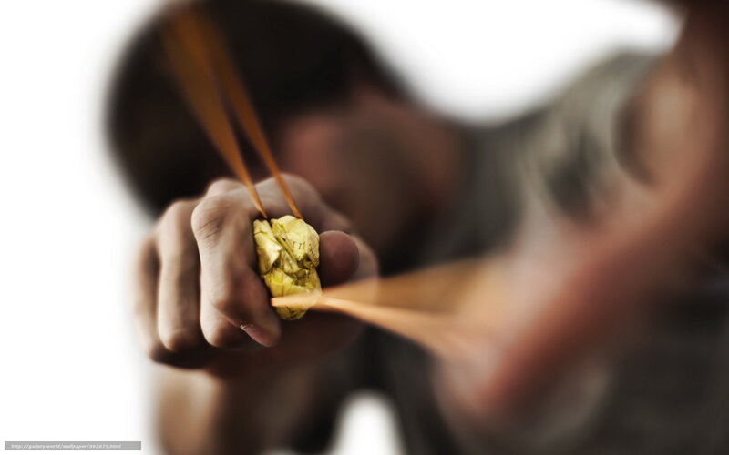 person using slingshot