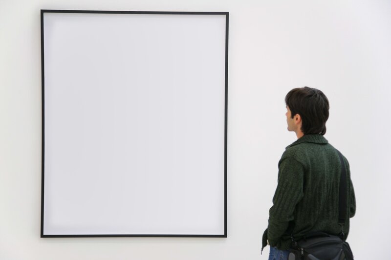 person viewing blank artwork