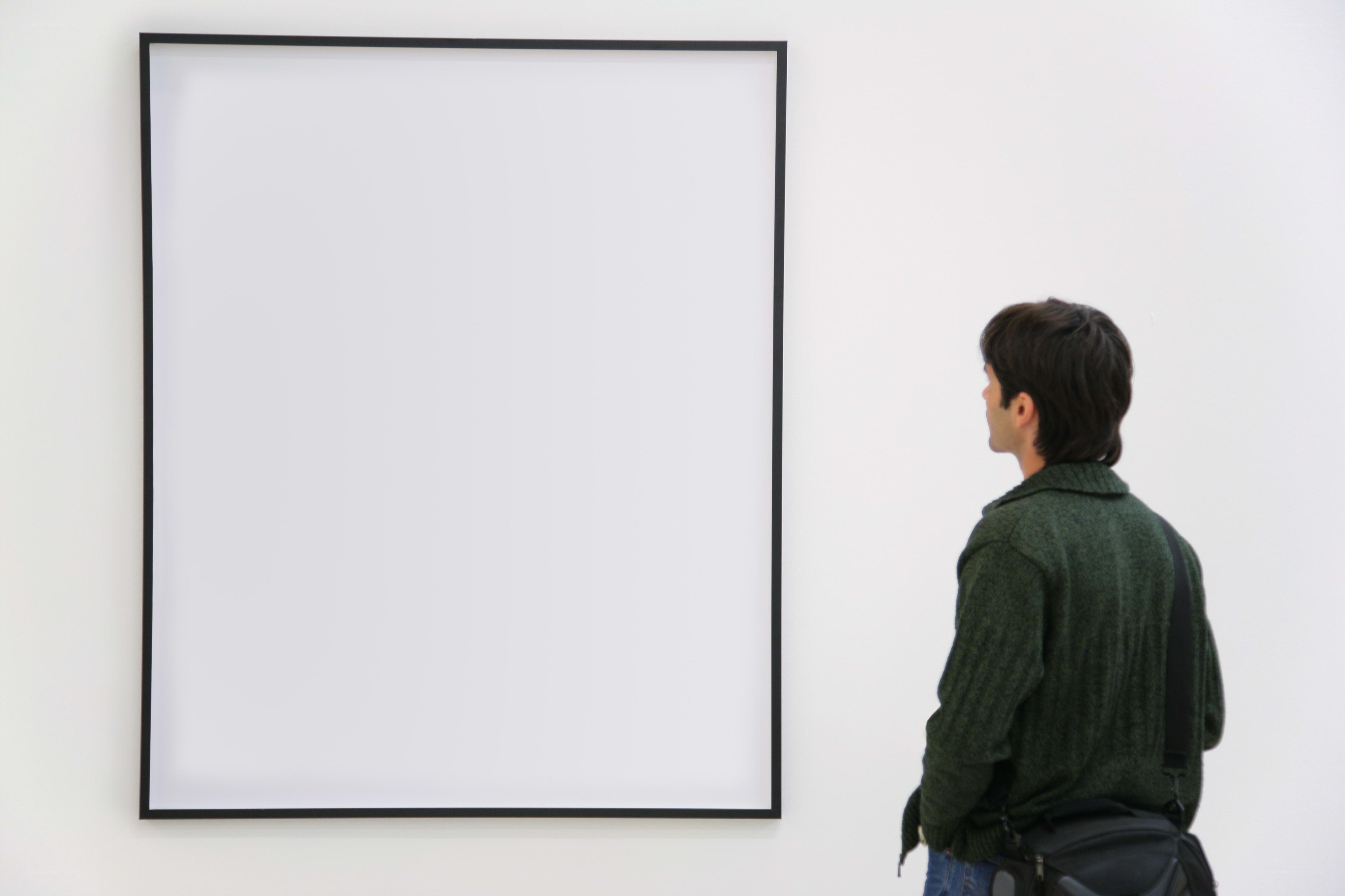 person viewing blank artwork