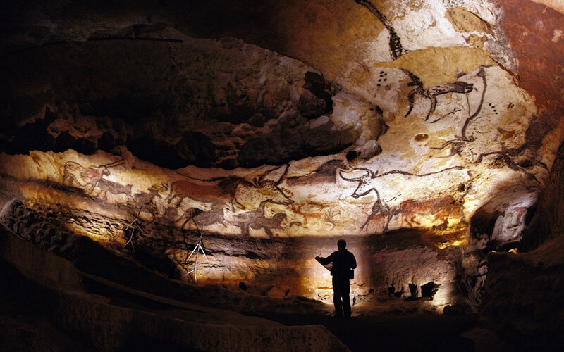 Person Viewing Cave Paintings — Brown