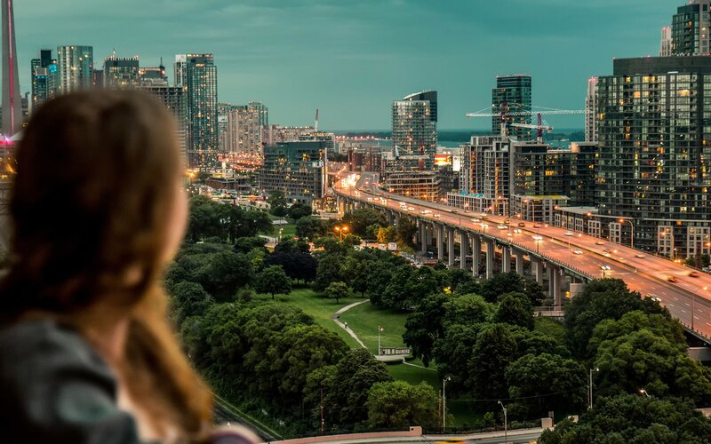 Person Viewing Cityscape — Green