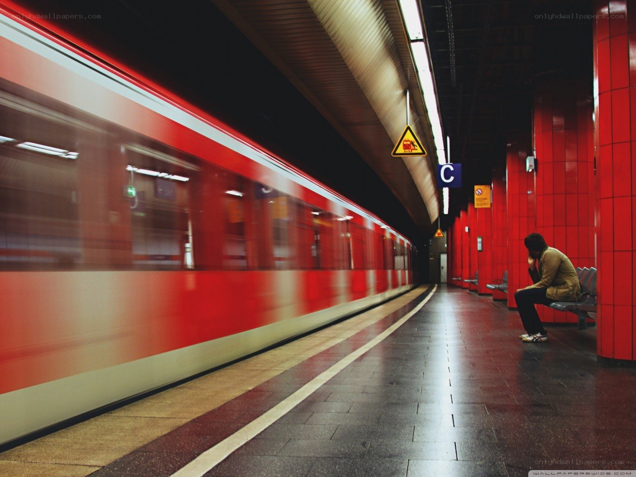 Person waiting on subway platform