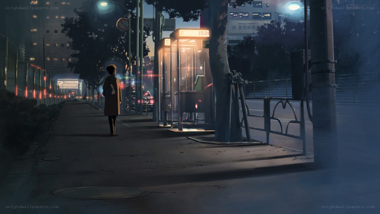 person walking at night in city