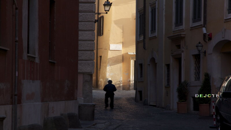 Person Walking Down Alley — Brown