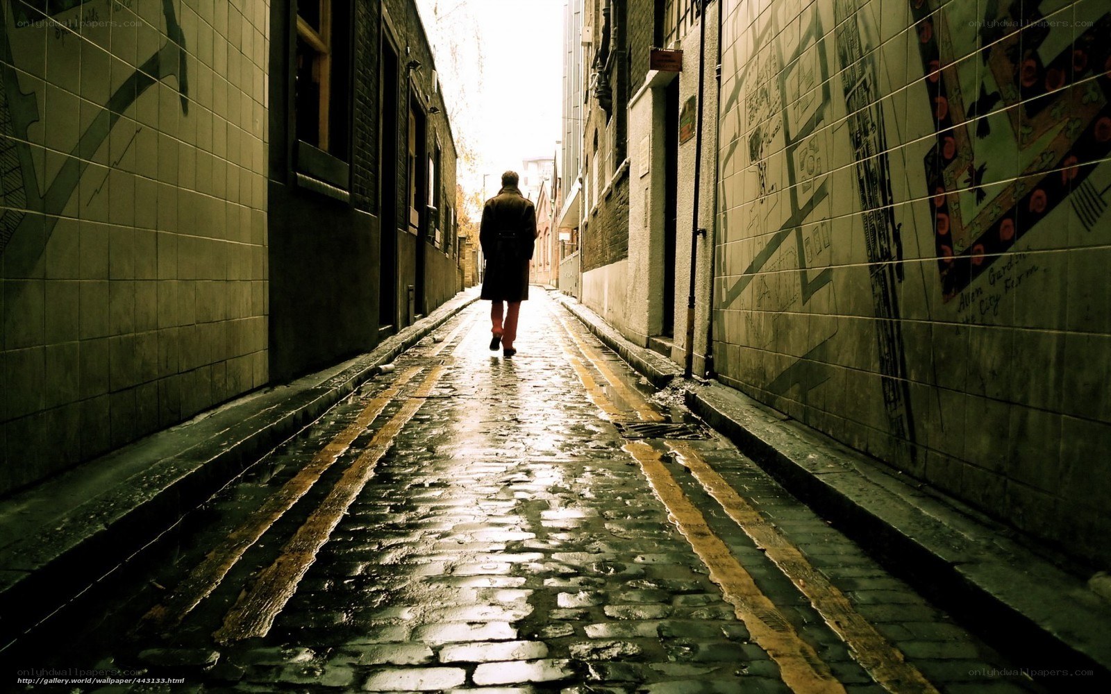 person walking down alley