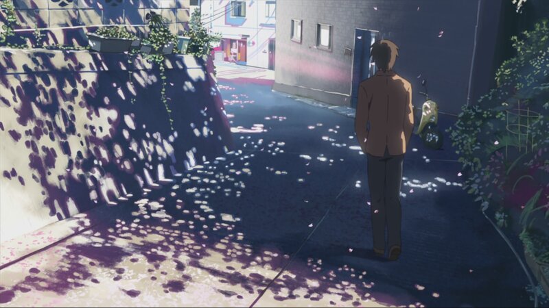 person walking down alleyway