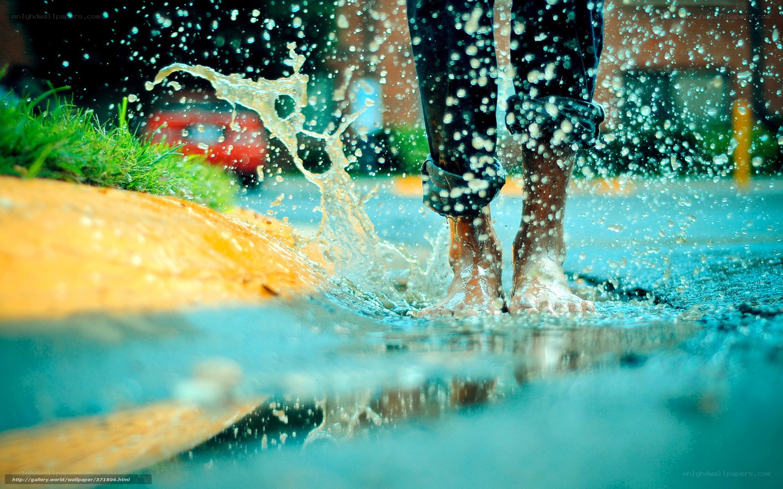 person walking in a puddle