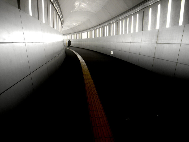 Person walking in a tunnel