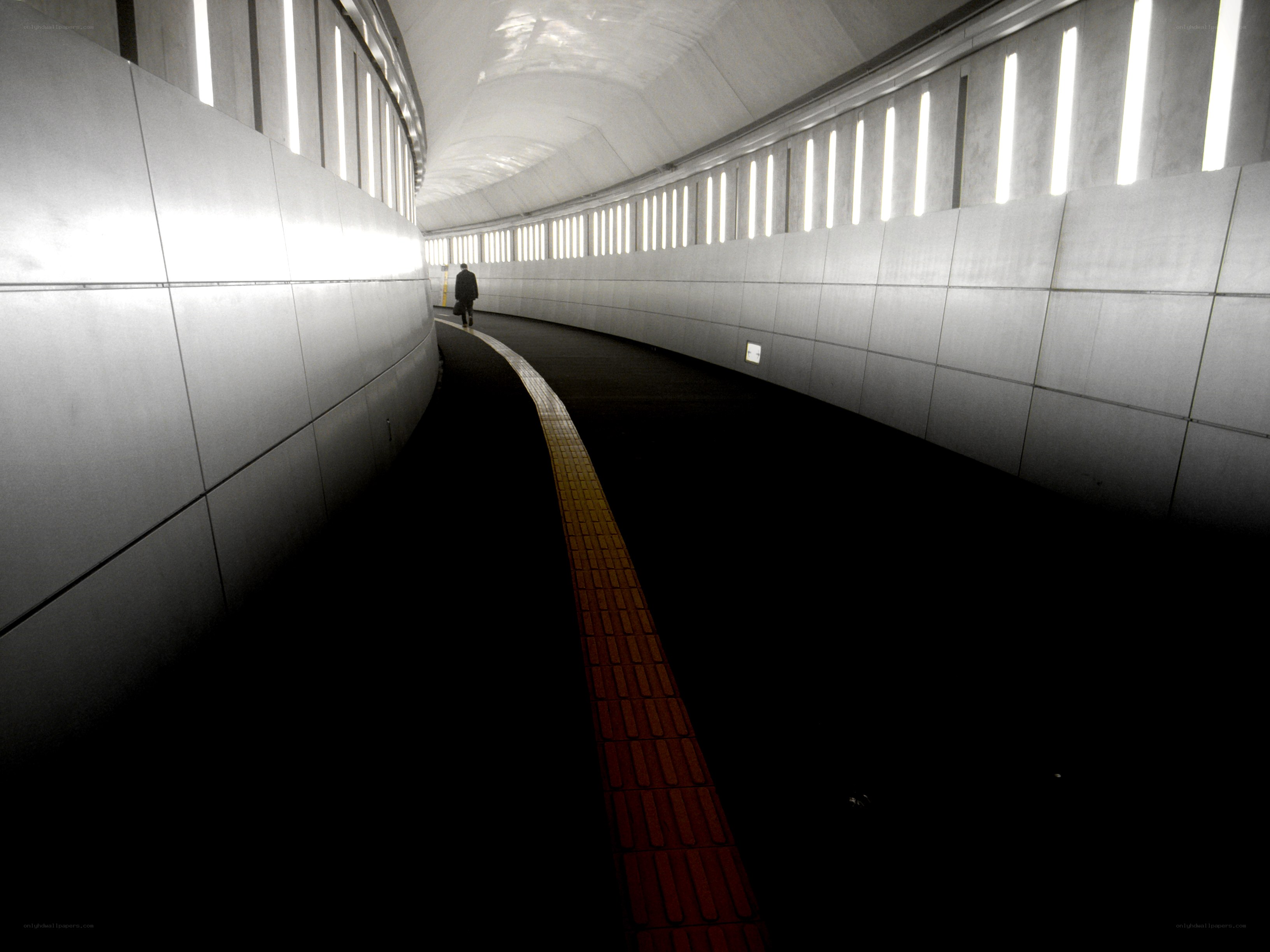 Person walking in a tunnel