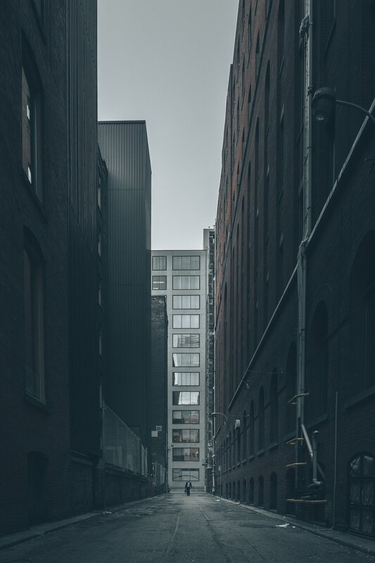 Person Walking in Alley — Gray, Dramatic