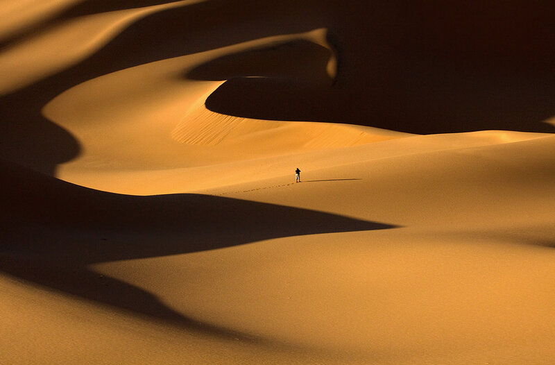 Person Walking in Desert — Orange