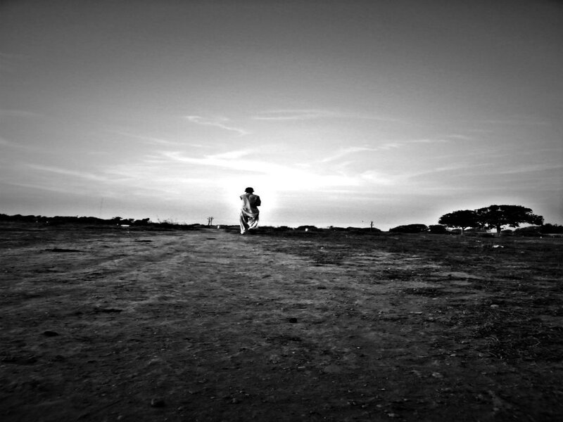 Person Walking in Field — Black, Serene