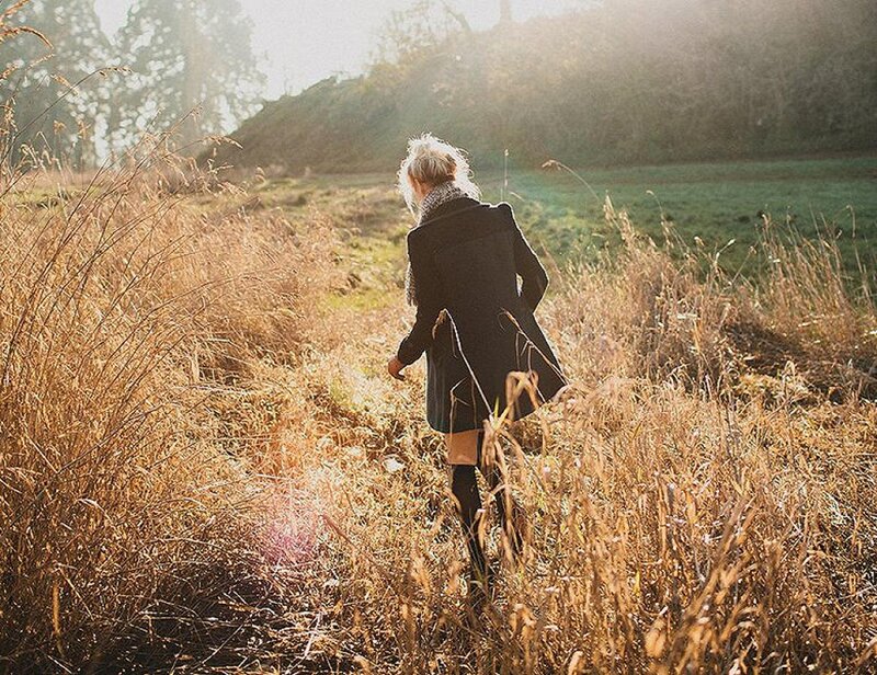 Person Walking in Field — Brown