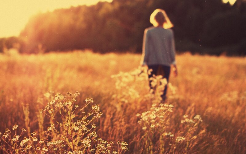 Person Walking in Field — Golden, Serene