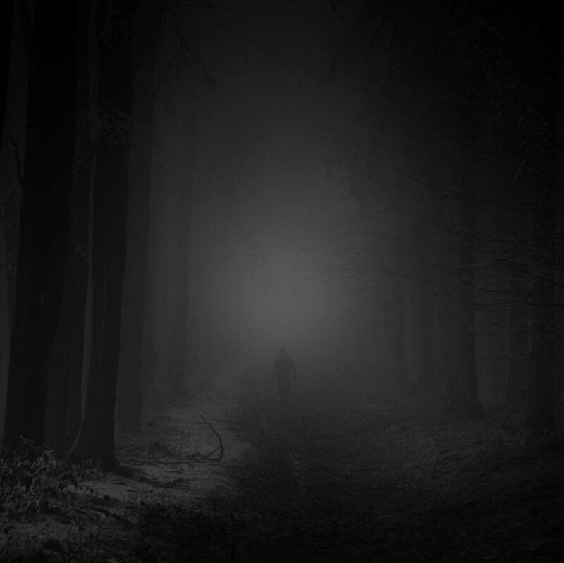 Person Walking in Fog — Black