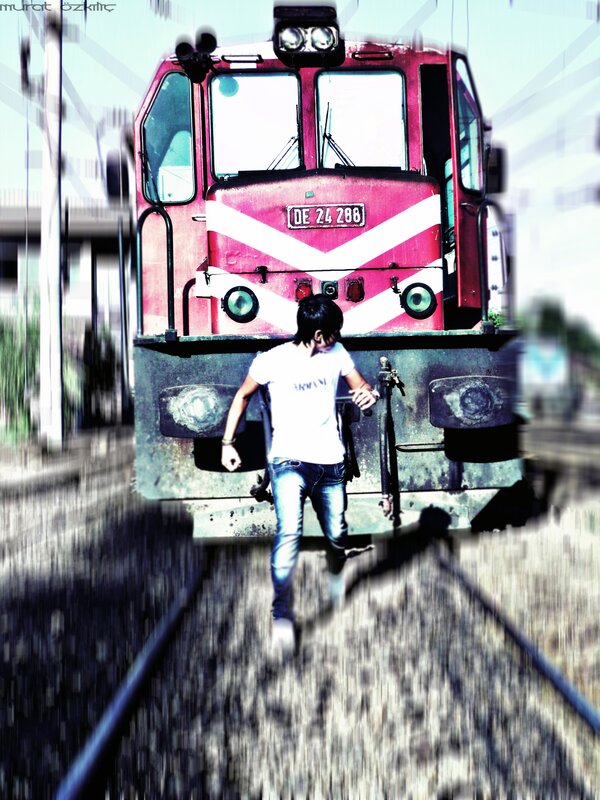 Person walking in front of a train