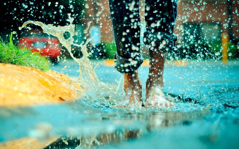 Person Walking in Puddle — Blue, Playful