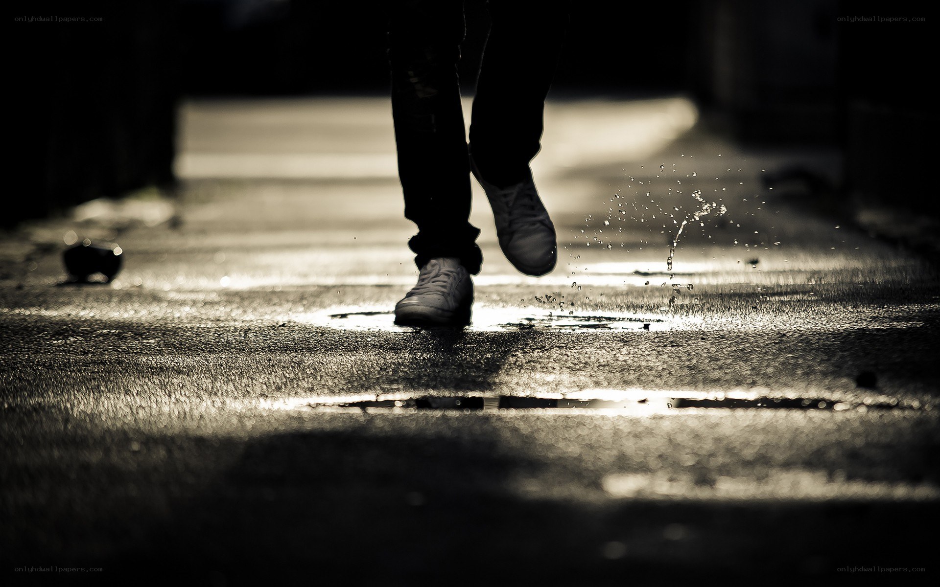 person walking in puddle