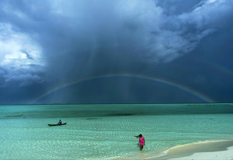 Person Walking in Shallow Water — Blue