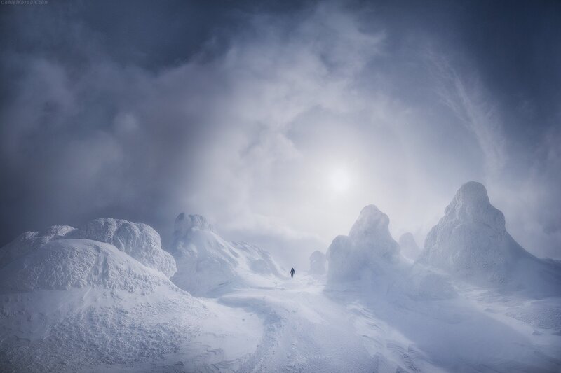 Person Walking in Snow — White, Dramatic, Winter, Photograph, Mountains
