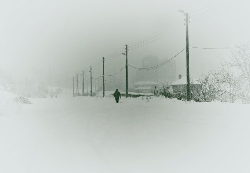 Person Walking in Snow — White, Dreary, Winter