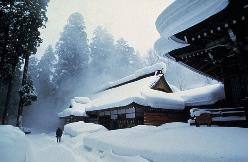 Person Walking in Snow — White, Serene, Winter, Photograph, Temple