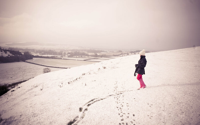 Person Walking in Snow — White, Serene, Winter