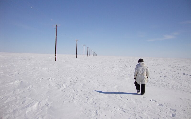 Person walking in snowy landscape