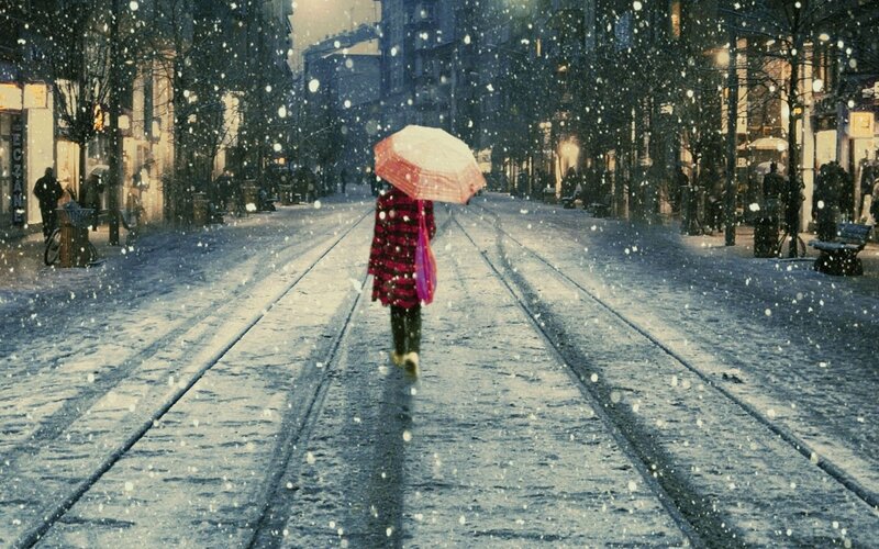 person walking in snowy street
