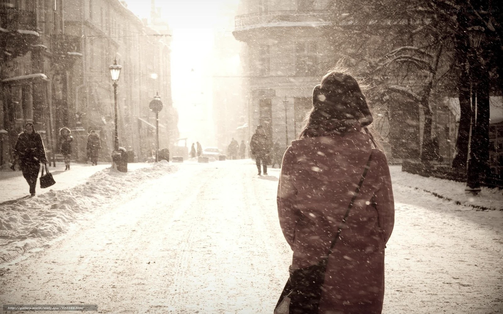 person walking in snowy street