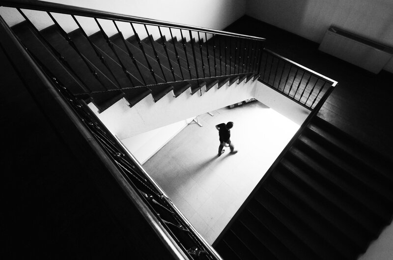 Person Walking in Stairwell