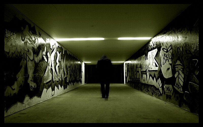 Person Walking in Tunnel — Green