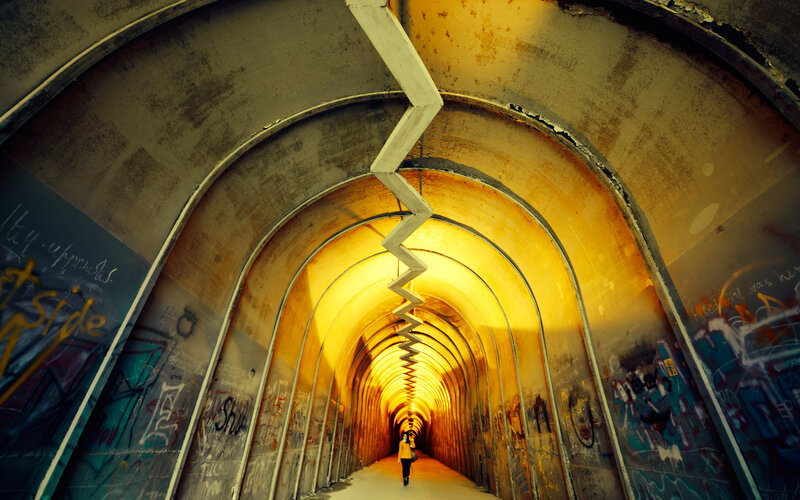 Person Walking in Tunnel — Yellow
