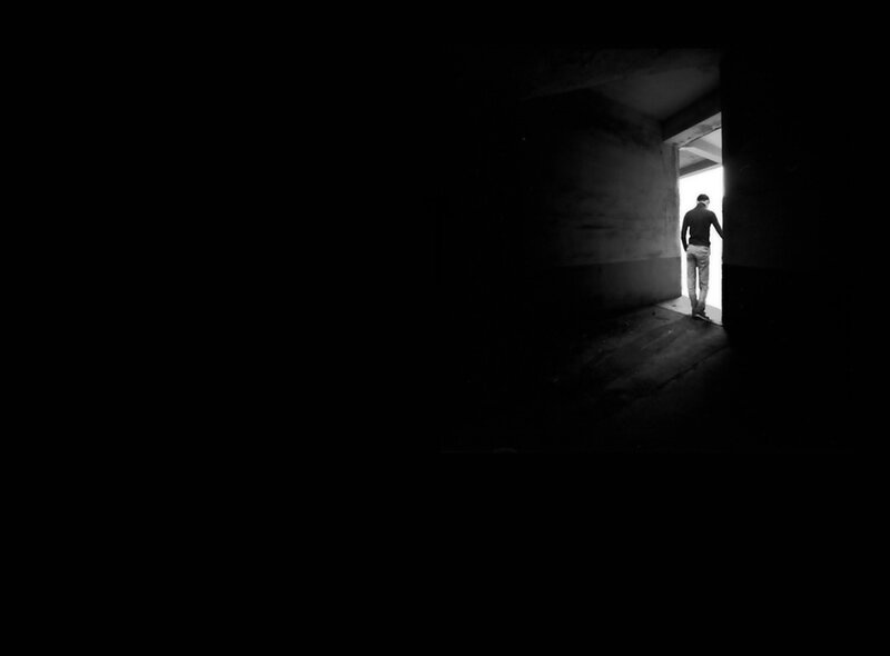 person walking into light