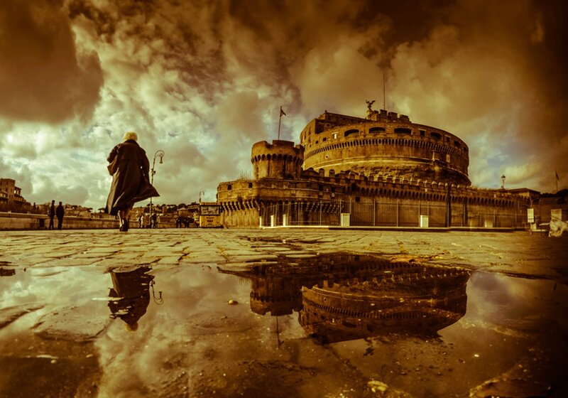 Person Walking Near Castle