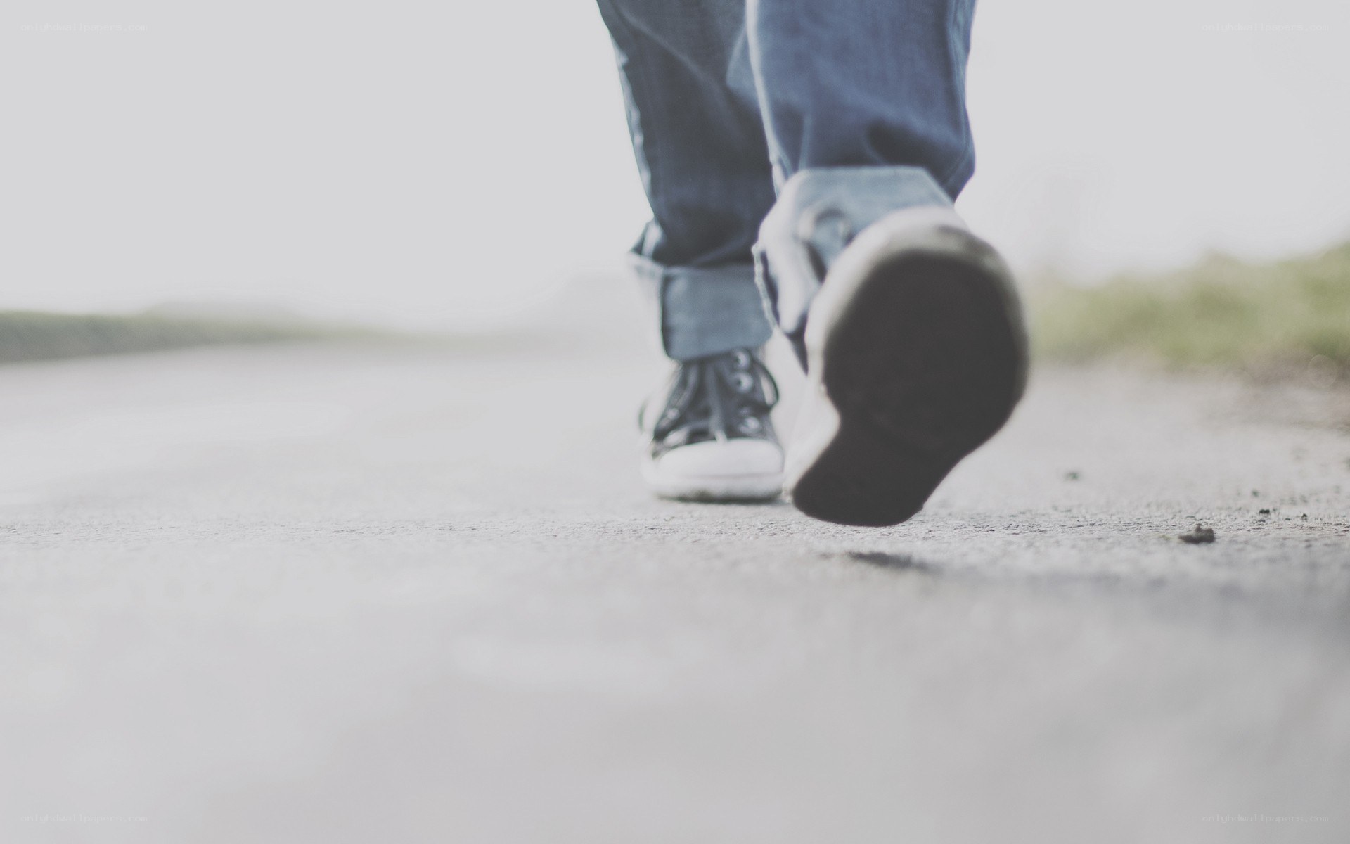 person walking on a road