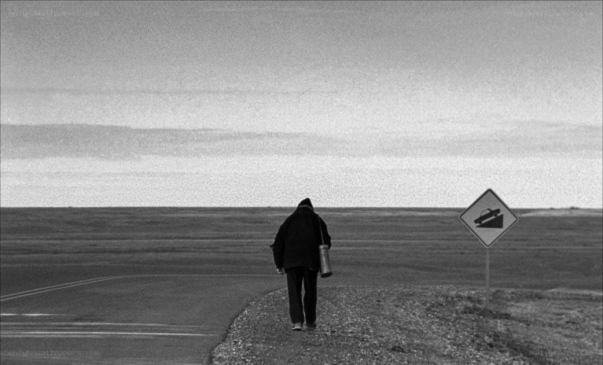 person walking on a road