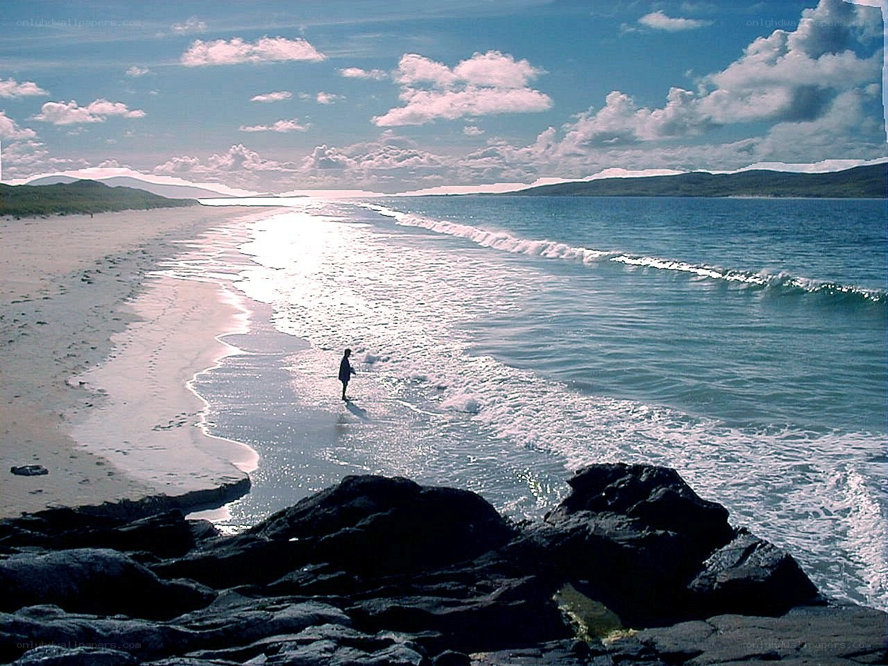 person walking on beach