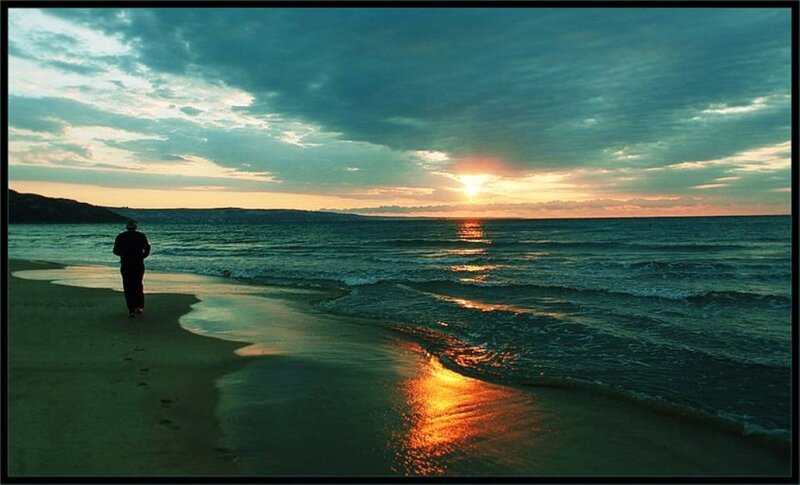 Person Walking on Beach — Blue