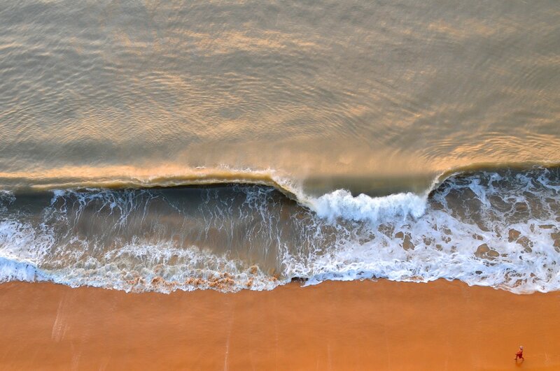 Person Walking on Beach — Brown, Serene, Sunset, Photograph