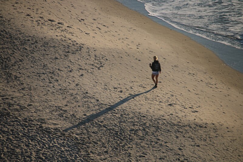Person Walking on Beach — Brown, Serene, Sunset