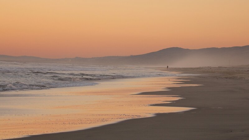 Person Walking on Beach — Orange, Serene
