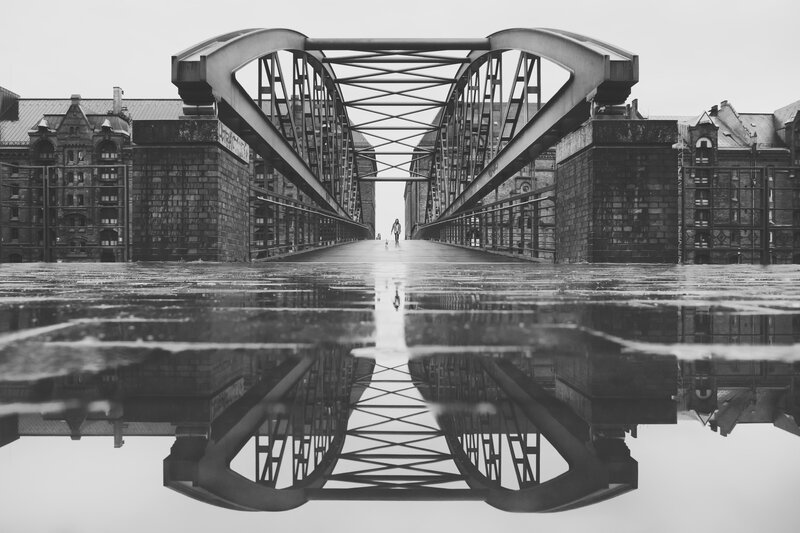 Person Walking on Bridge — Black, Dramatic, Photograph