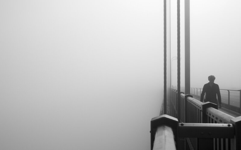 Person Walking on Bridge — Black, Misty, Photograph