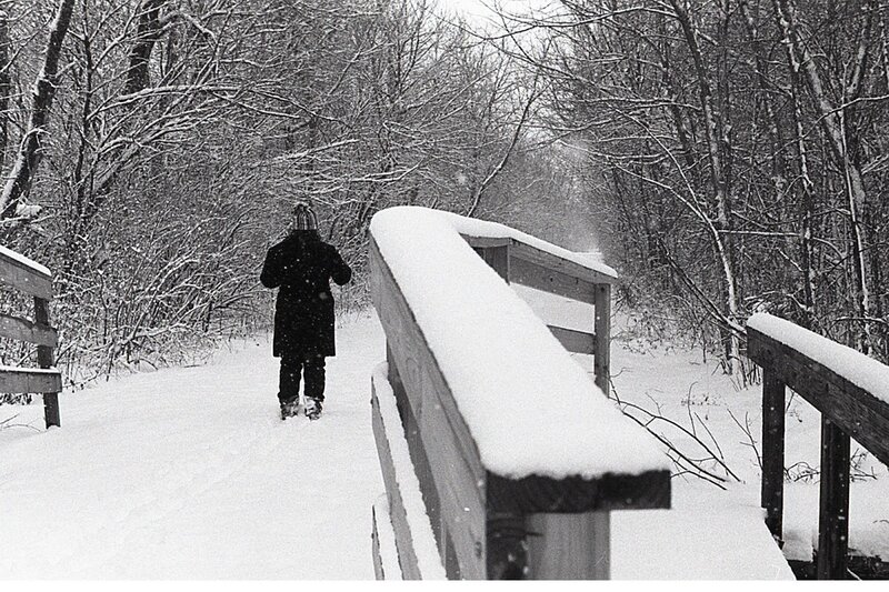 Person Walking on Bridge — Black, Quiet