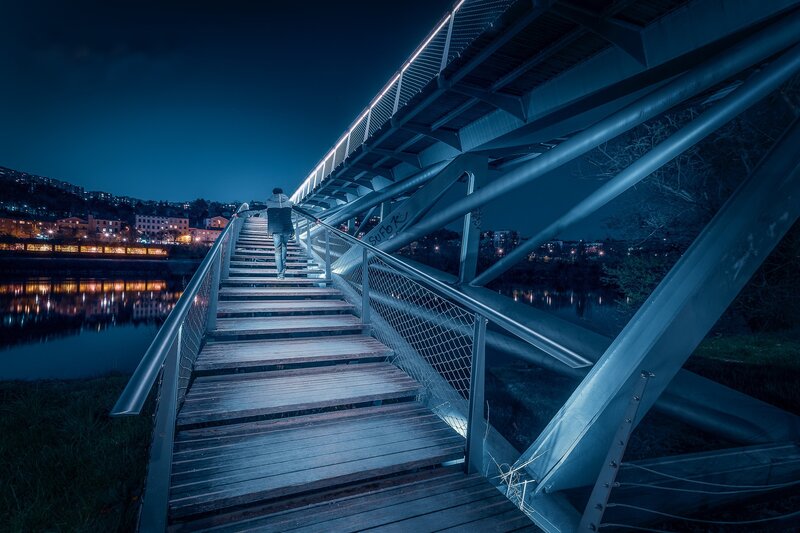 Person Walking on Bridge — Blue, Dramatic, Night